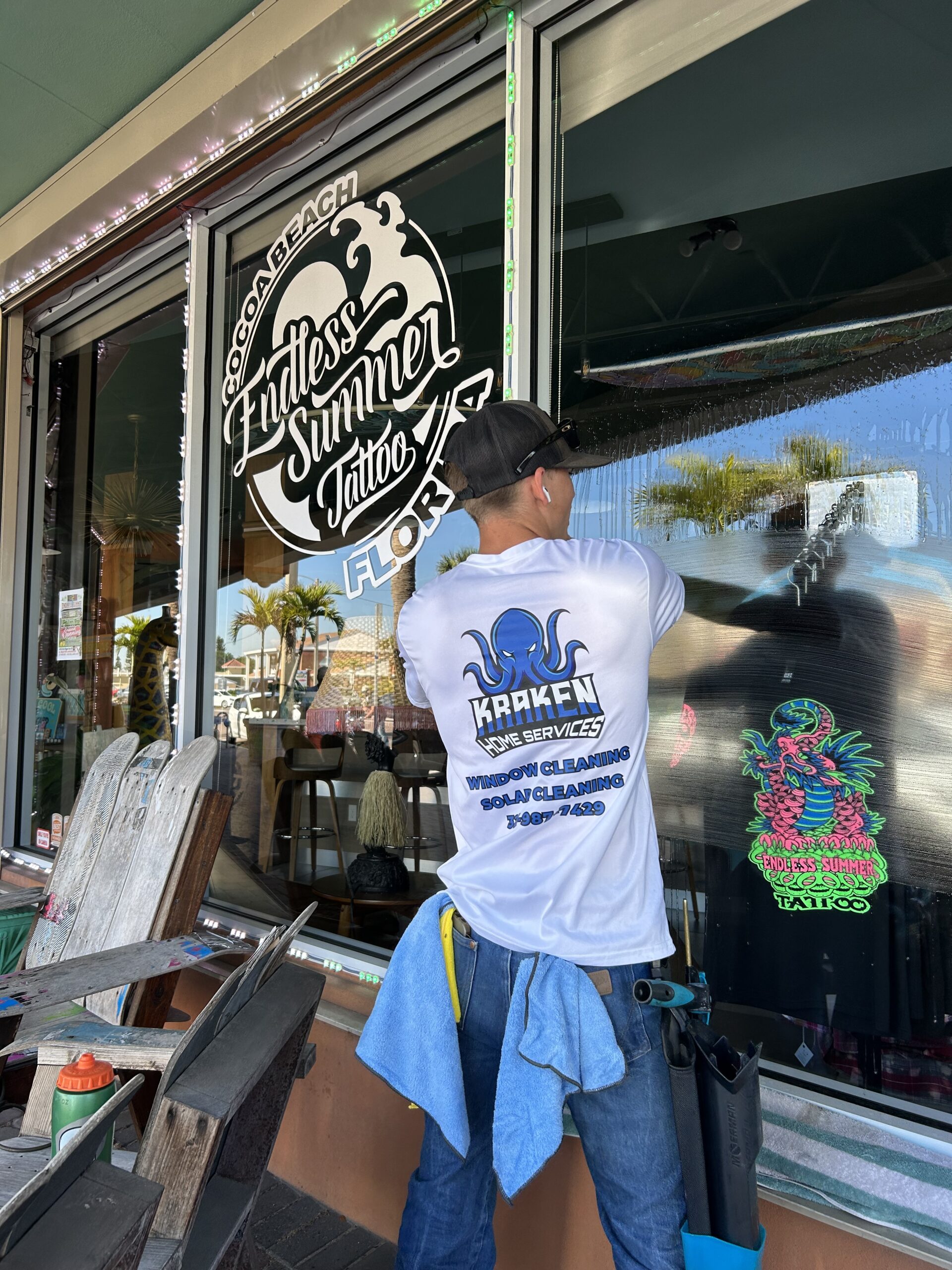 Window cleaning in downtown Cocoa Beach at Endless Summer Tattoo