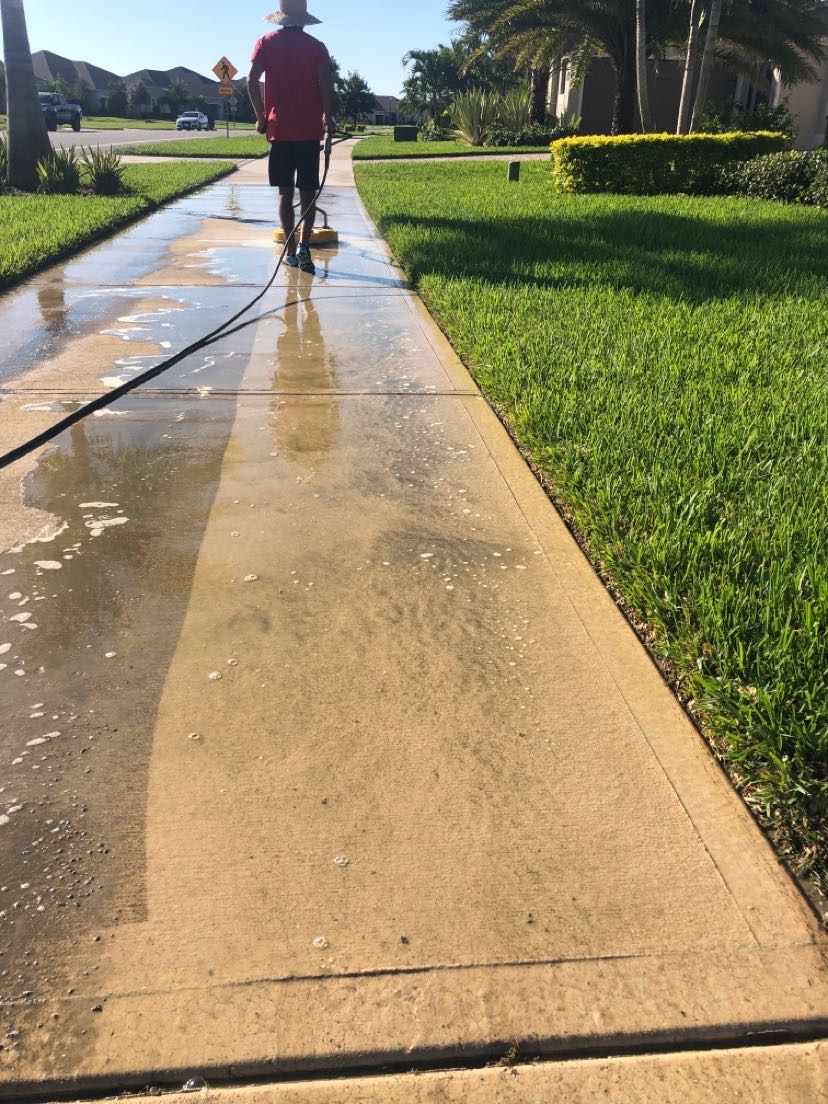 Pressure washing a driveway in Viera Florida